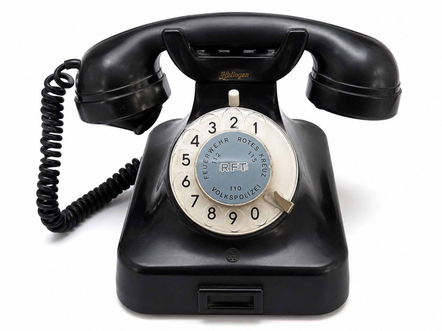 Vintage Heliogen RFT tárcsás telefon fekete bakelit kivitelben, működőképes retro vezetékes telefon gyűjtőknek és lakásdekorációnak.